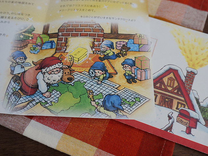 熊本地震で被災した子どもたちに送られた「サンタクロースからの手紙」。イラストの中でサンタクロースが九州の地図を見ている。